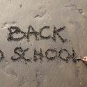 back to school written in the sand